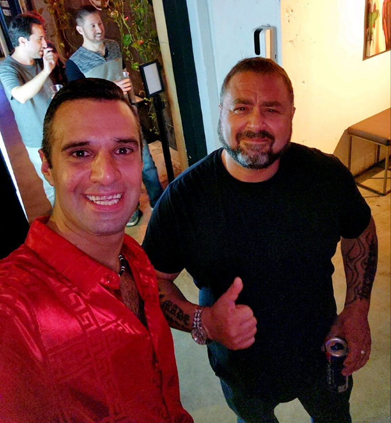 Mark Ghoriafi Founder, MrPremium.com, talking GEO domains with John Colascione (self), at the South Florida Domainers meetup in Fort Lauderdale, May 25th, 2023.