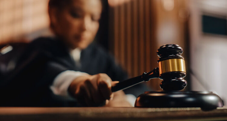 Apple introduces restrictive compliance measures that critics claim defied the ruling.