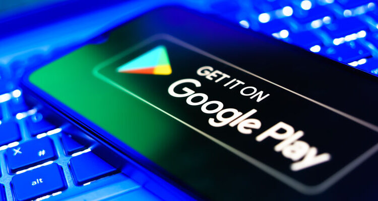 Prague, Czechia - 7 23 2024: Smartphone on surface showing Get it on Google Play logo. Google Play is an app store.